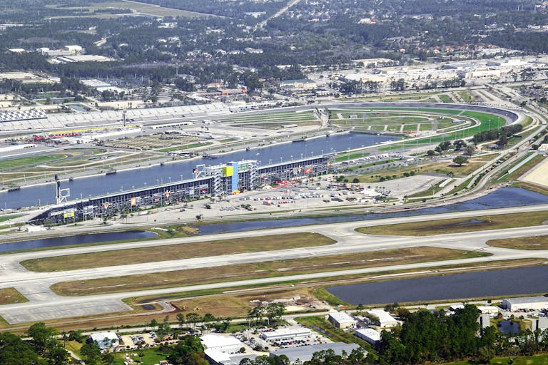 Aerial shot of Daytona International Speedway, Florida, showcasing iconic race track and surroundings.
